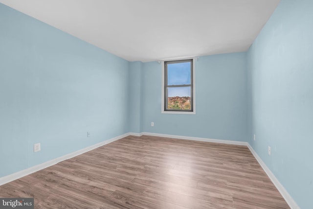 unfurnished room featuring light hardwood / wood-style flooring