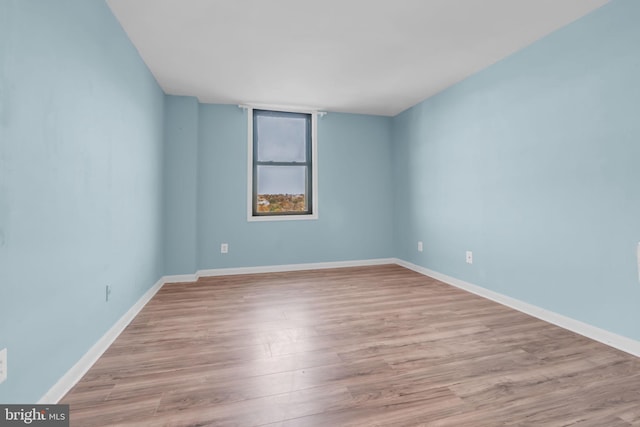 spare room featuring light hardwood / wood-style floors