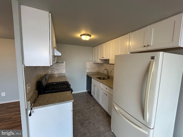 kitchen featuring white cabinetry, sink, backsplash, stone countertops, and black appliances