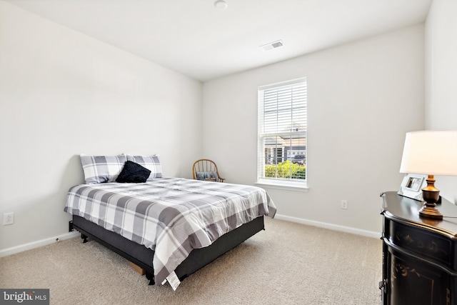 bedroom with light carpet