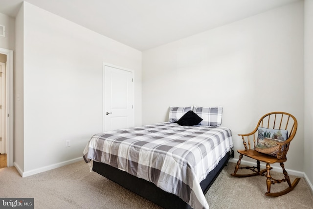 bedroom with light carpet