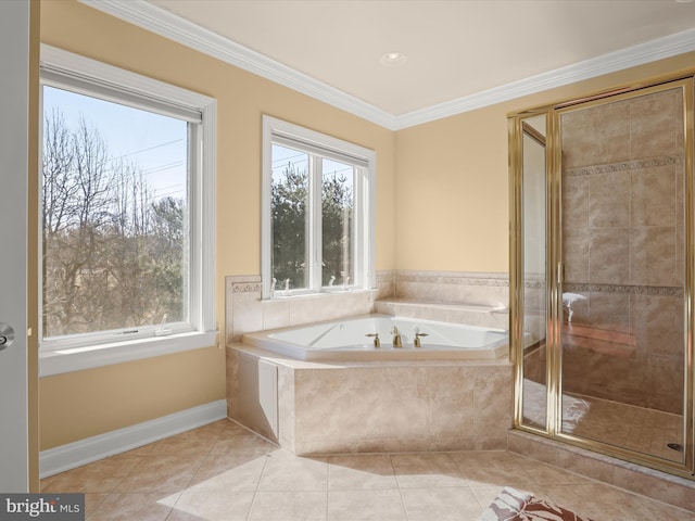 bathroom featuring a bath, a wealth of natural light, tile patterned flooring, and crown molding