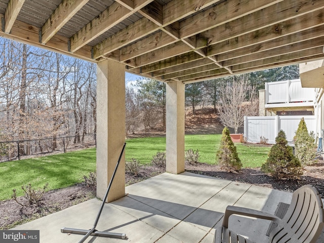 view of patio featuring fence