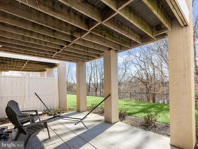 view of patio / terrace featuring fence