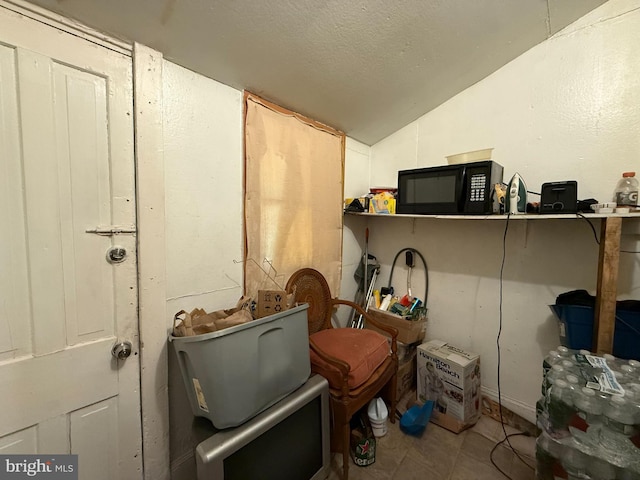 misc room featuring lofted ceiling