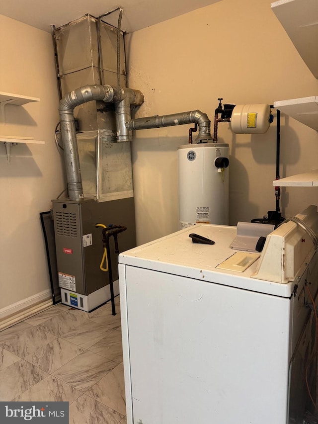 clothes washing area with heating unit, gas water heater, and washer / dryer