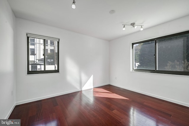 empty room with hardwood / wood-style floors