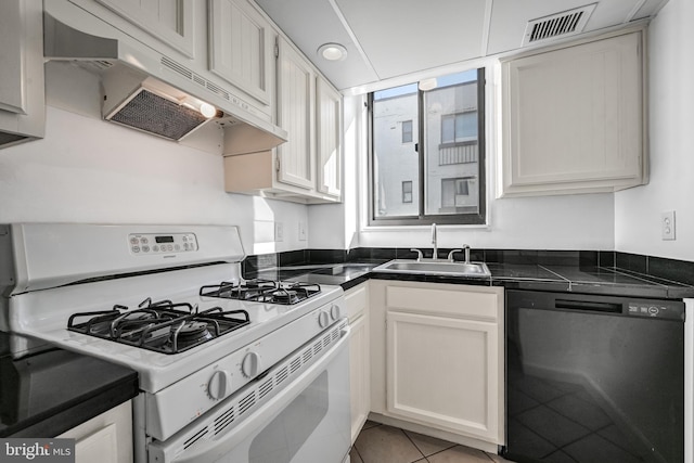 kitchen featuring white gas range, ventilation hood, sink, dishwasher, and white cabinetry