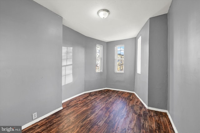 spare room featuring hardwood / wood-style floors