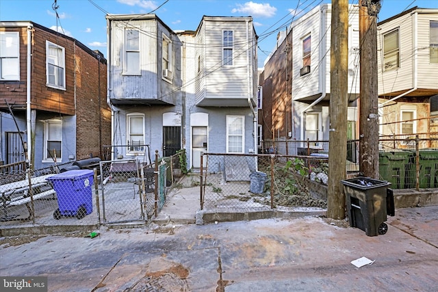 1311 N Luzerne Ave, Baltimore, MD 21213 - townhome / multi-family property featuring brick siding, a fenced front yard, and a gate