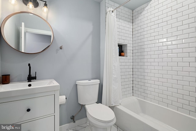 full bathroom with vanity, toilet, and shower / tub combo with curtain