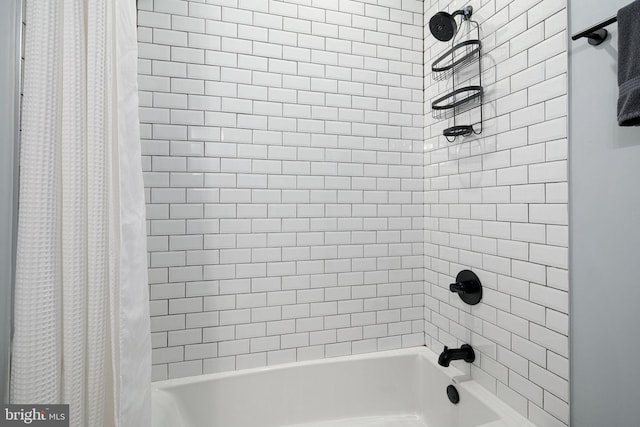 bathroom with shower / tub combo with curtain