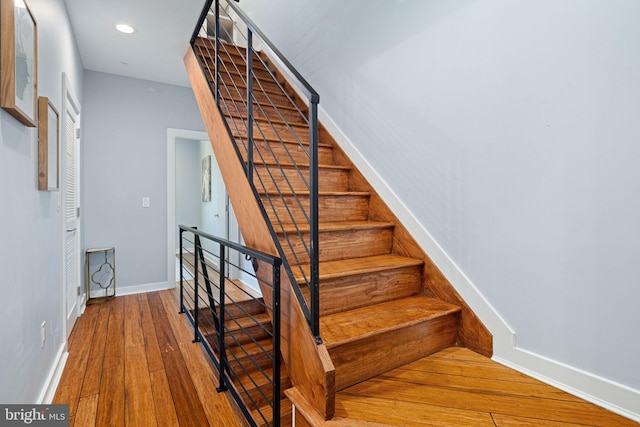 stairway featuring hardwood / wood-style flooring