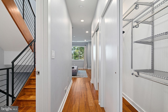 hall with wood-type flooring