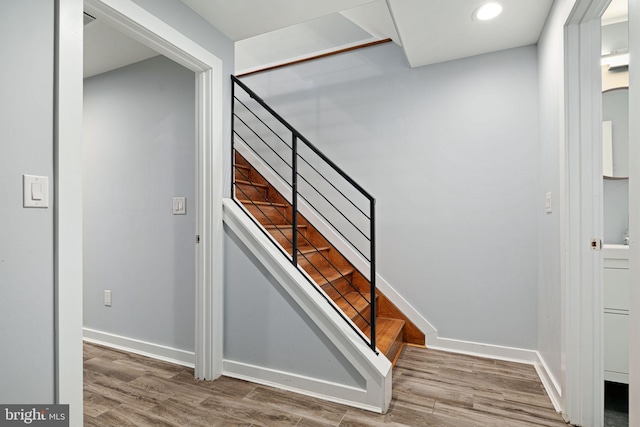 staircase featuring hardwood / wood-style floors