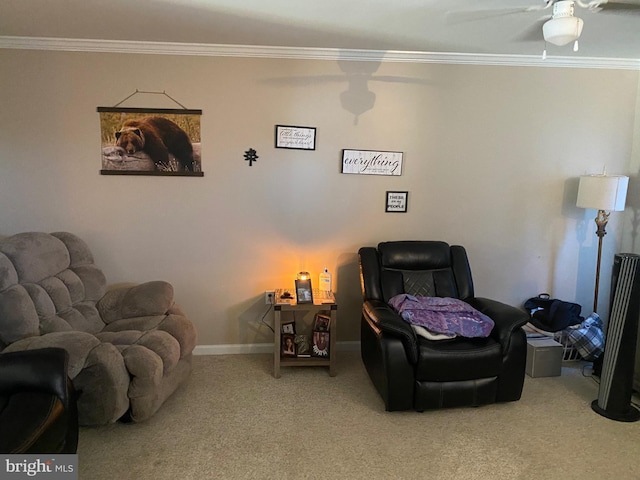 carpeted living room featuring crown molding and ceiling fan