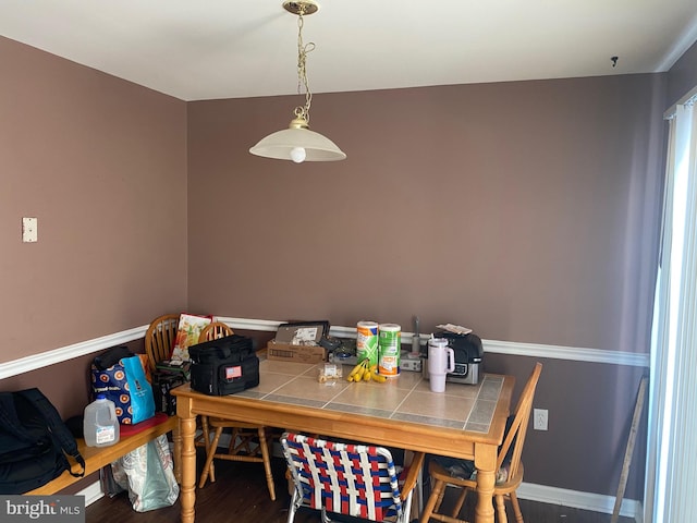 dining area featuring wood-type flooring