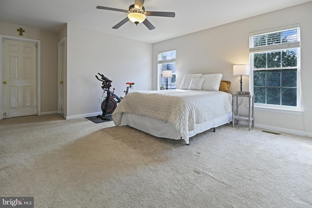 bedroom featuring ceiling fan and light colored carpet