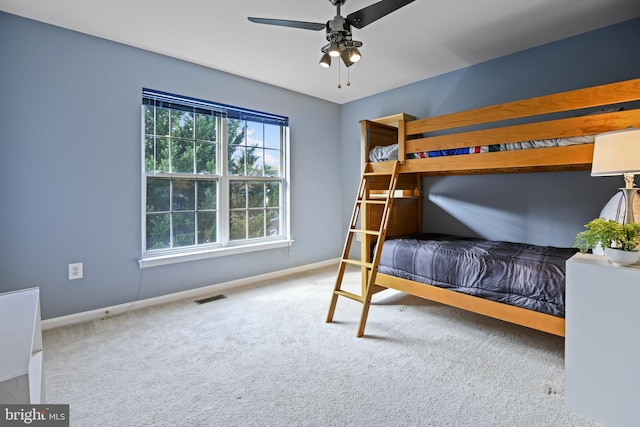 unfurnished bedroom featuring ceiling fan and carpet