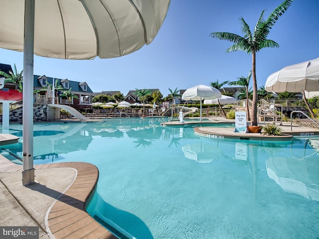 view of swimming pool featuring a water slide