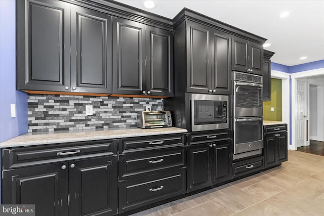 kitchen featuring tasteful backsplash and stainless steel appliances