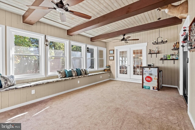 unfurnished sunroom featuring french doors, beam ceiling, and ceiling fan