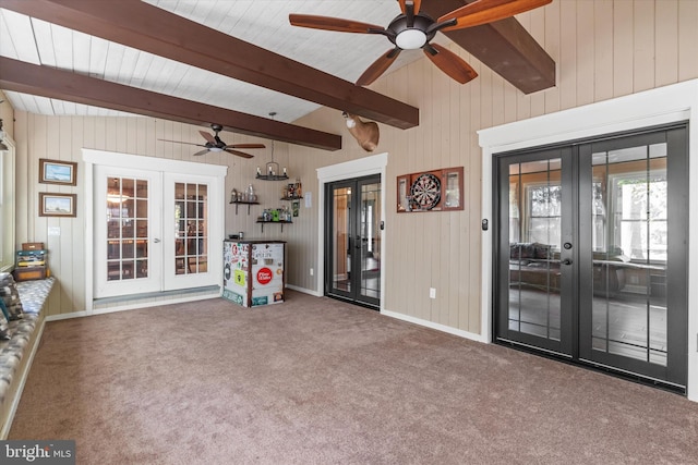 interior space with french doors and lofted ceiling with beams