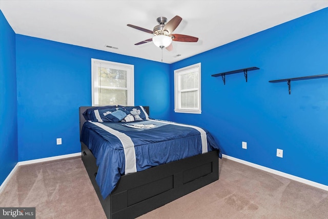 bedroom with ceiling fan and carpet