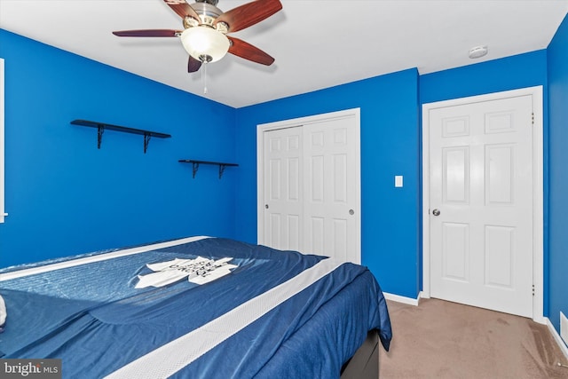 bedroom featuring a closet, carpet floors, and ceiling fan