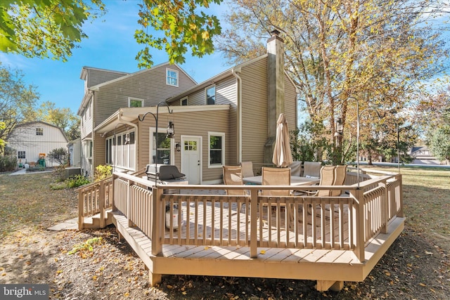 rear view of house with a deck