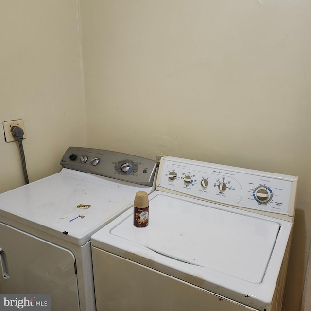 clothes washing area featuring washer and dryer