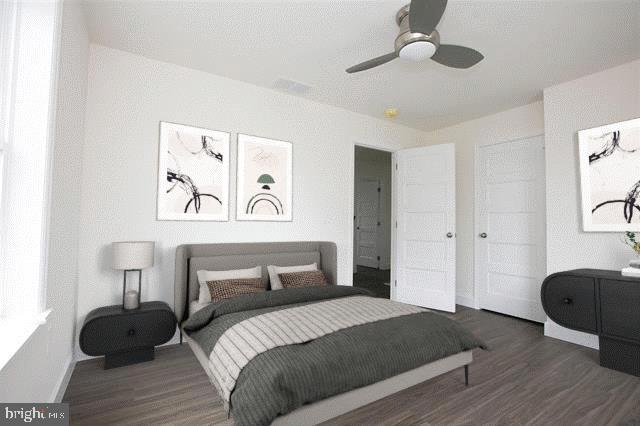 bedroom featuring dark hardwood / wood-style floors and ceiling fan