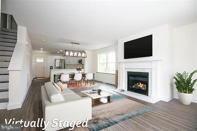 living room featuring dark wood-type flooring