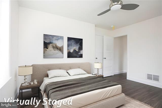 bedroom with hardwood / wood-style flooring and ceiling fan