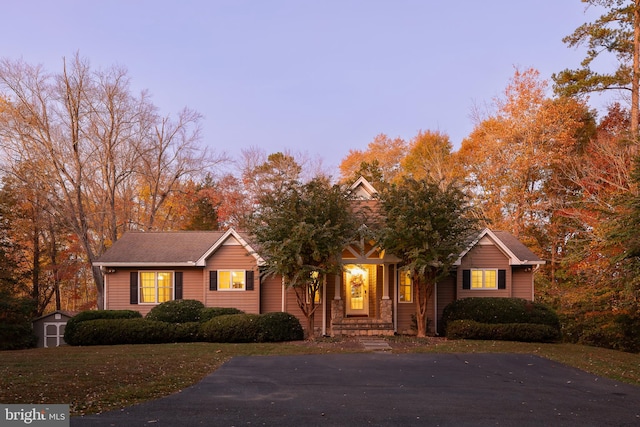 view of front of home with a storage unit