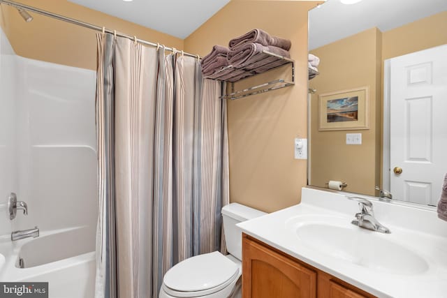 full bathroom with vanity, toilet, and shower / bath combo with shower curtain