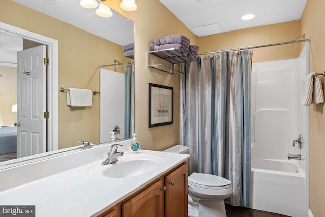 full bathroom featuring vanity, shower / bath combo with shower curtain, toilet, and hardwood / wood-style flooring