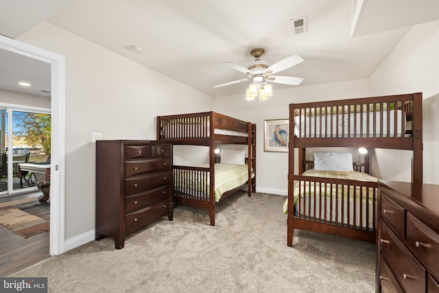 bedroom featuring light carpet, access to outside, and ceiling fan