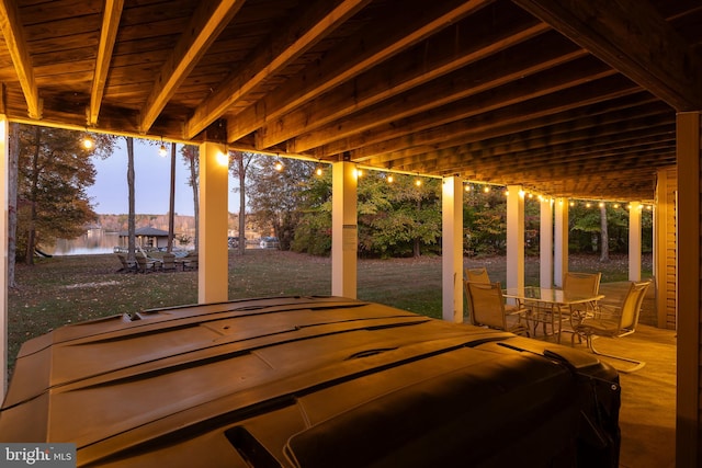 patio terrace at dusk with a water view