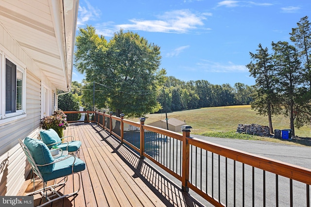 wooden deck with a lawn