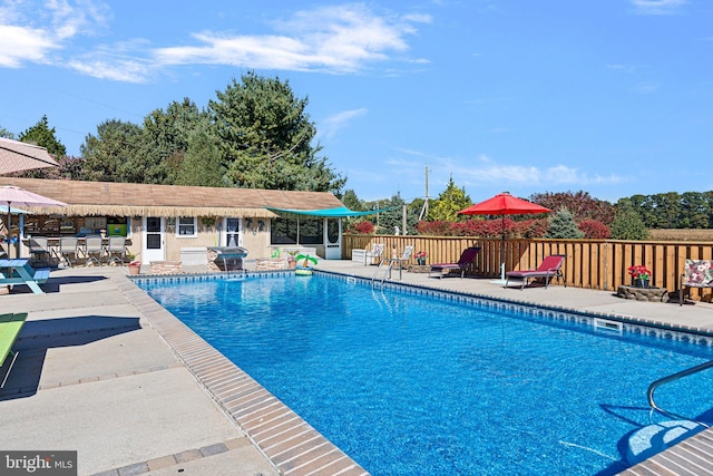 view of swimming pool with a patio area