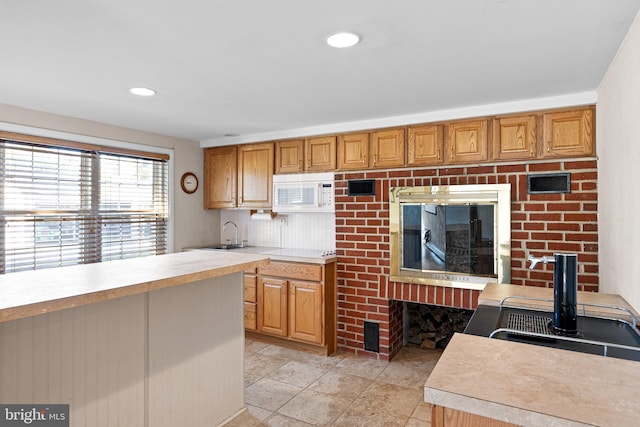 kitchen with sink and light tile patterned floors