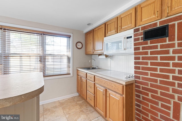 kitchen with sink and white appliances