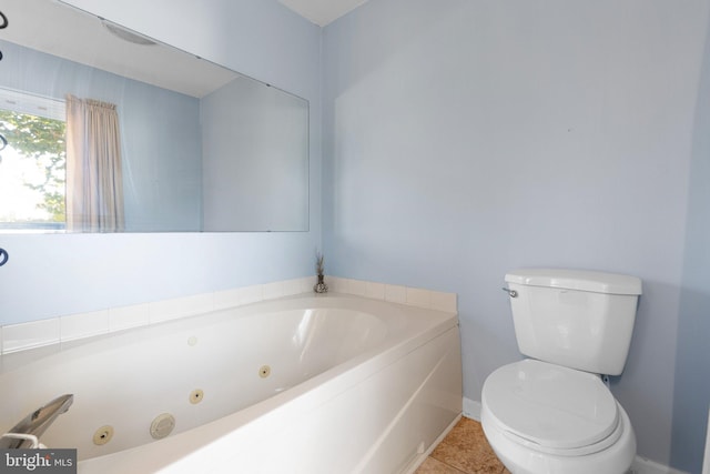 bathroom featuring toilet, tile patterned floors, and a washtub