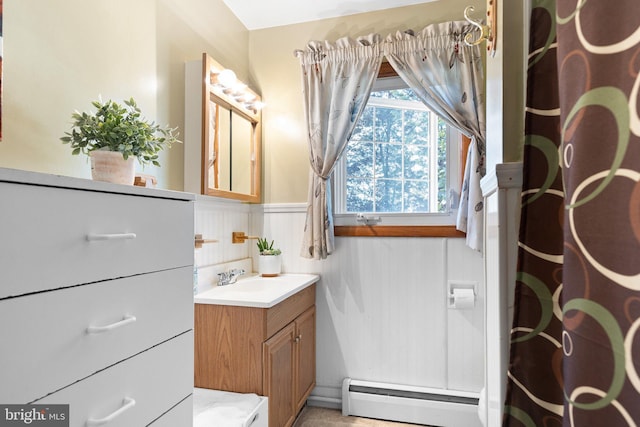 bathroom with vanity, a baseboard radiator, and a shower with curtain