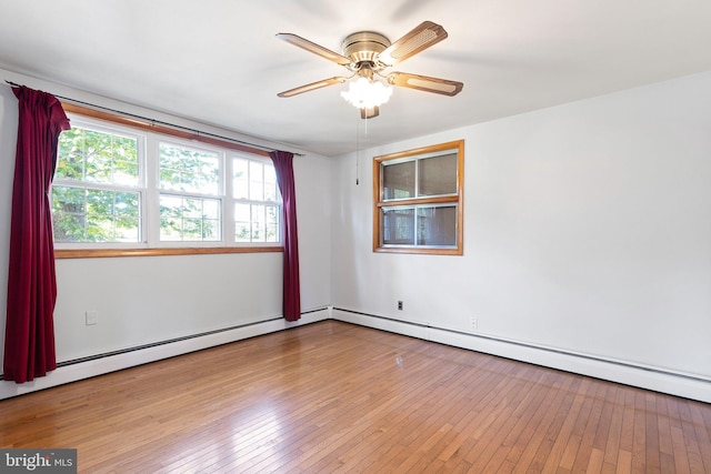 unfurnished room with light hardwood / wood-style flooring, a baseboard heating unit, and ceiling fan