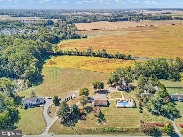 birds eye view of property with a rural view