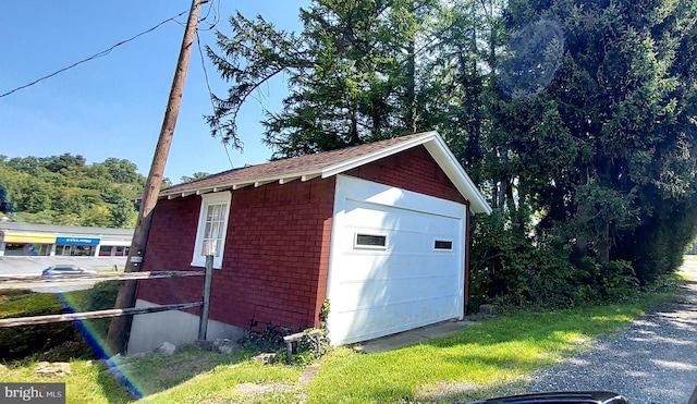 view of outdoor structure with a garage