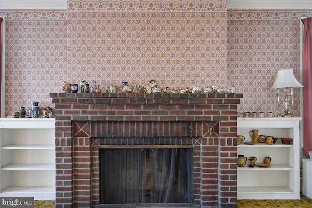 details with built in features, ornamental molding, and a fireplace