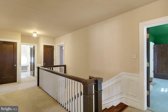 hallway with light carpet